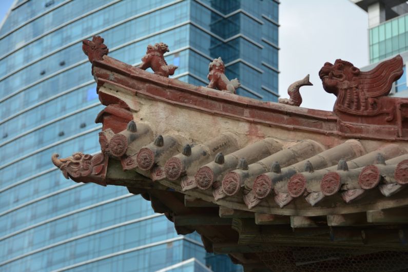 Accommodations - a close up of a roof with a building in the background