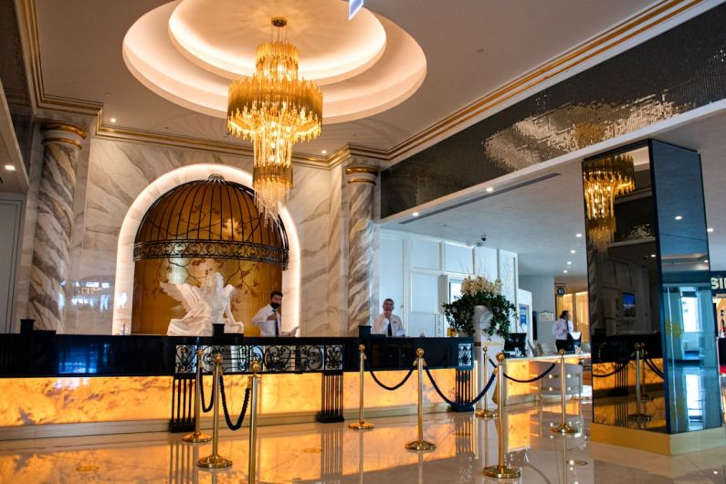 Hotels - gold chandelier on white ceiling