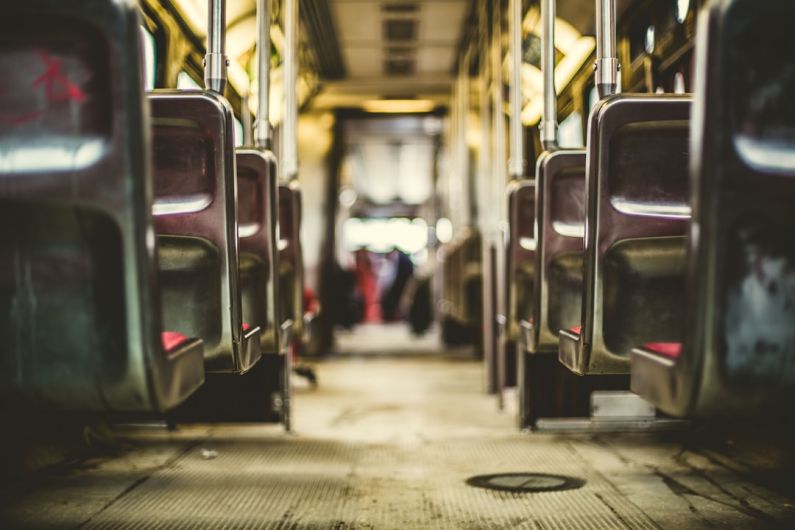 Public Transportation - selective focus photo of vehicle passenger seat