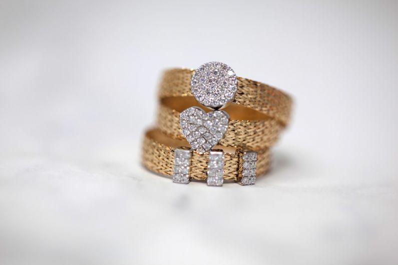 Jewelry - three gold-colored studded rings