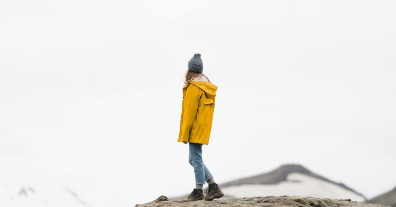 Solo Traveler - Woman Standing Alone on a Mountain