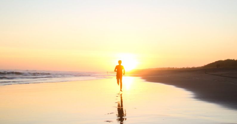 Traveling With Kids - Silhouette of Boy Running in Body of Water during Sunset