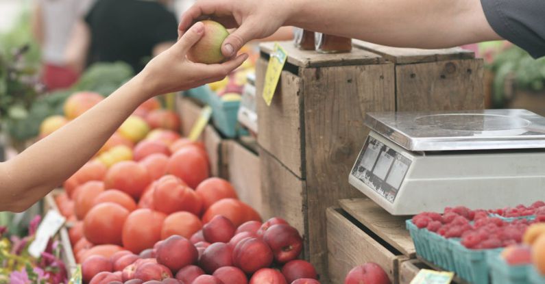 Local Customs - Person Giving Fruit to Another