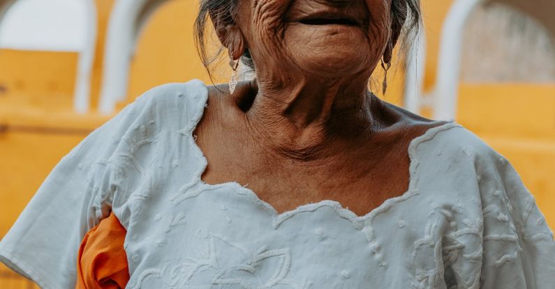 Mayan Culture - Smiling Elderly Woman in White Blouse