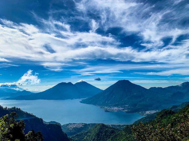 Guatemala - green mountains under white clouds and blue sky during daytime