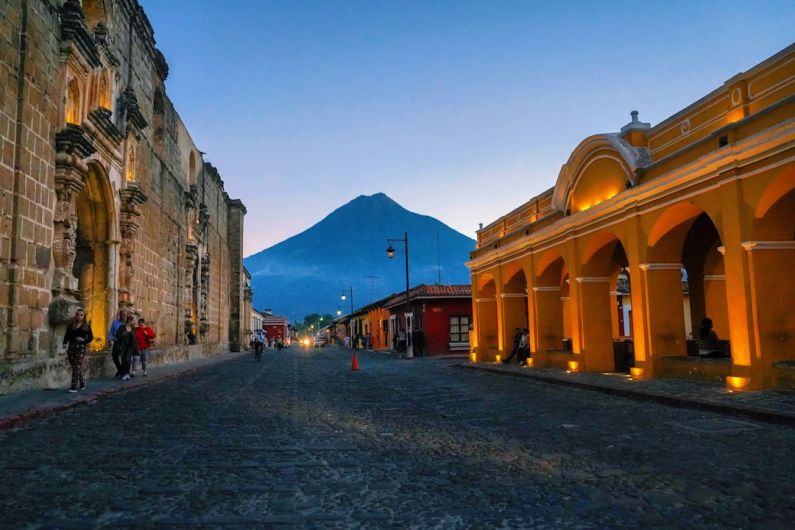 Guatemala - brown concrete building near mountain