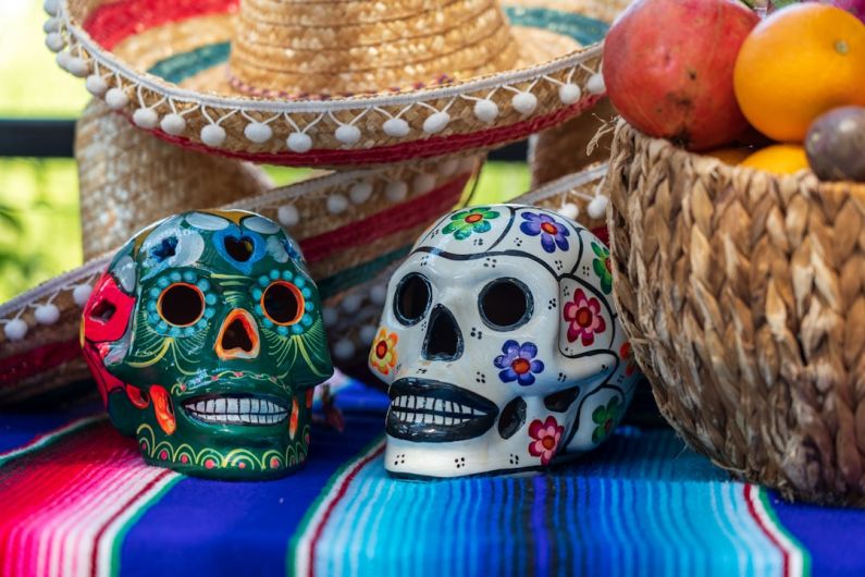 Day Of The Dead - white and red ceramic skull figurine