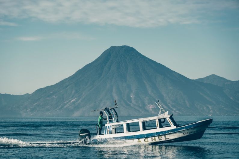 Panajachel - a boat sailing in the sea