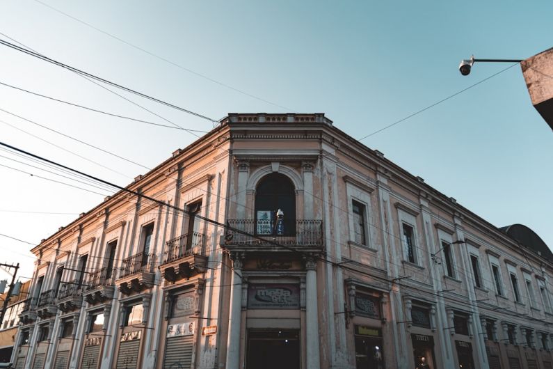 Quetzaltenango - a tall building with a clock on the front of it