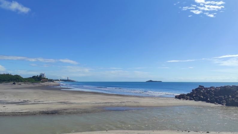 Playa Blanca - a sandy beach with a small island in the distance